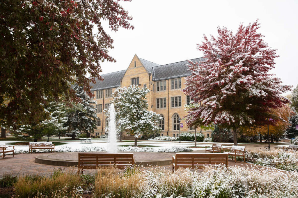 A fall snowfall covers autumn leaves across the St. Paul campus. Mark Brown/University of St. Thomas