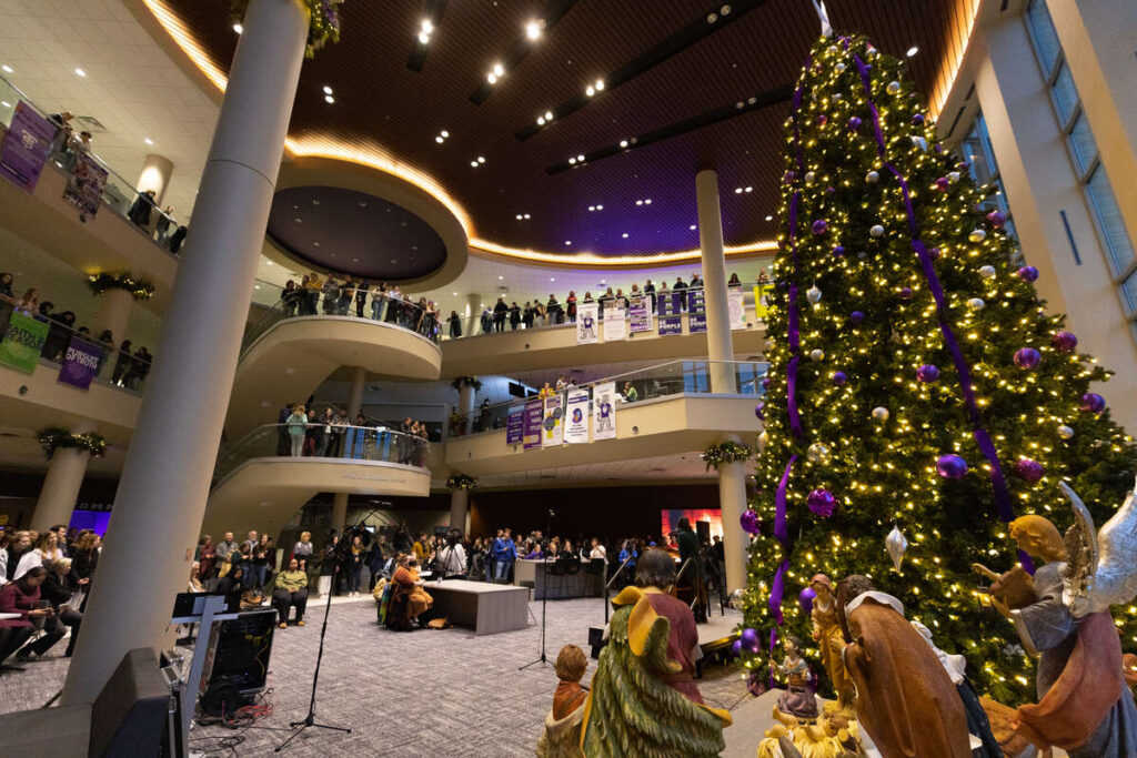 Faculty, staff and students gather during the Holiday Tree Lighting Ceremony in the Anderson Student Center. Mark Brown/University of St. Thomas