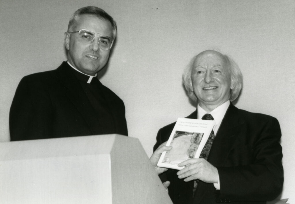 Father Dennis Dease and Michael D. Higgins.