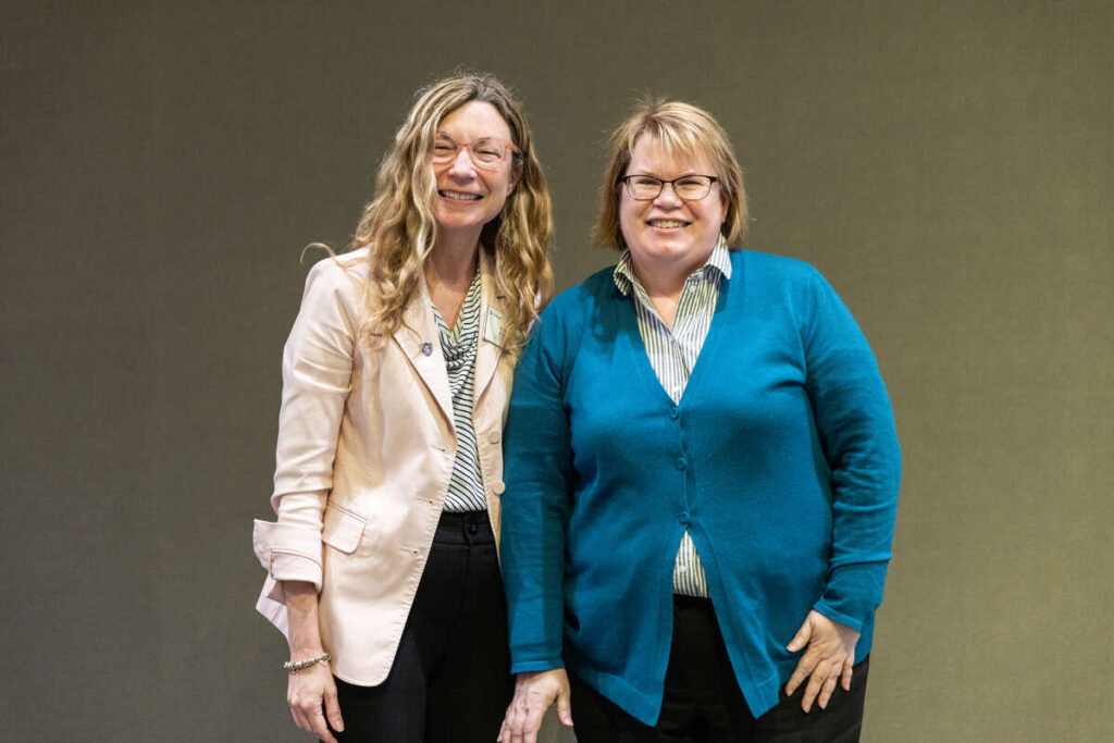Ann Kenne, head of Special Collections, with Kathy Arnold from Human Resources during the Employee Recognition Celebration. Mark Brown/University of St. Thomas
