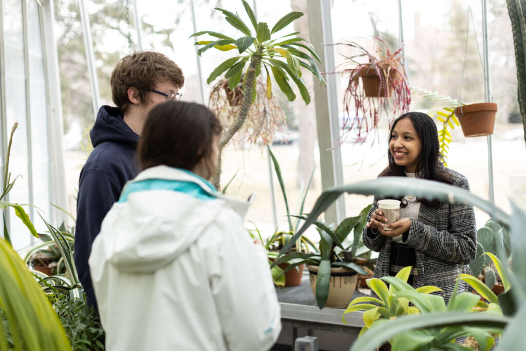 Students drink tea at the JRC Greenhouse during Free Tea Thursdays on March 30, 2023, in St. Paul. Mark Brown/University of St. Thomas