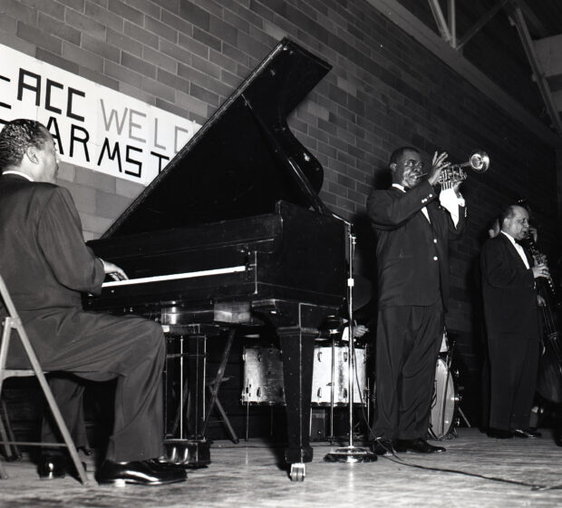 Louis Armstrong performing.