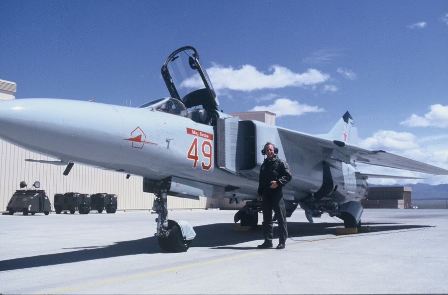 Rob Zettel by a fighter jet.