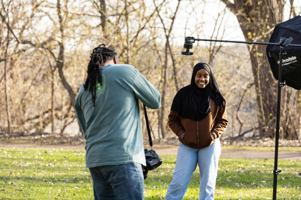 Students in Mark Neuzil’s Environmental Journalism class participate in editorial photos for a feature story about Earth Day for the Star Tribune at Shadow Falls Park. Mark Brown/University of St. Thomas