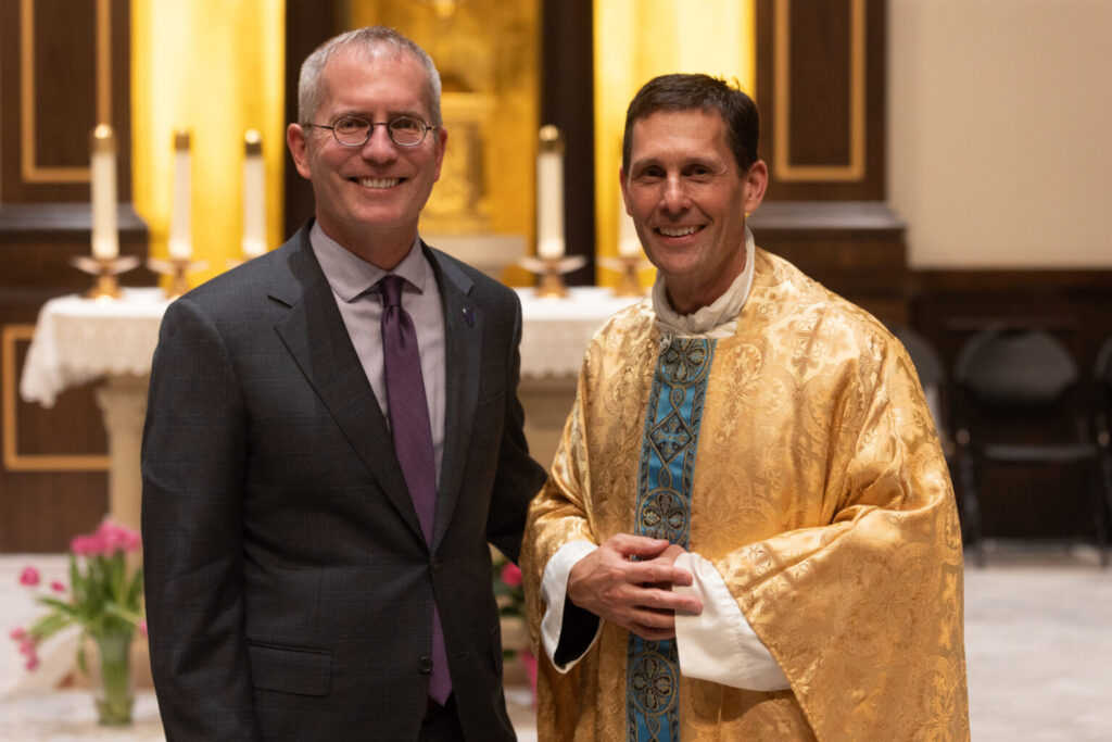Rob Vischer and Father Jonathan Kelly.
