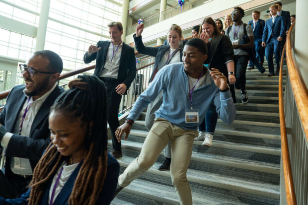 Students dancing on stairs.