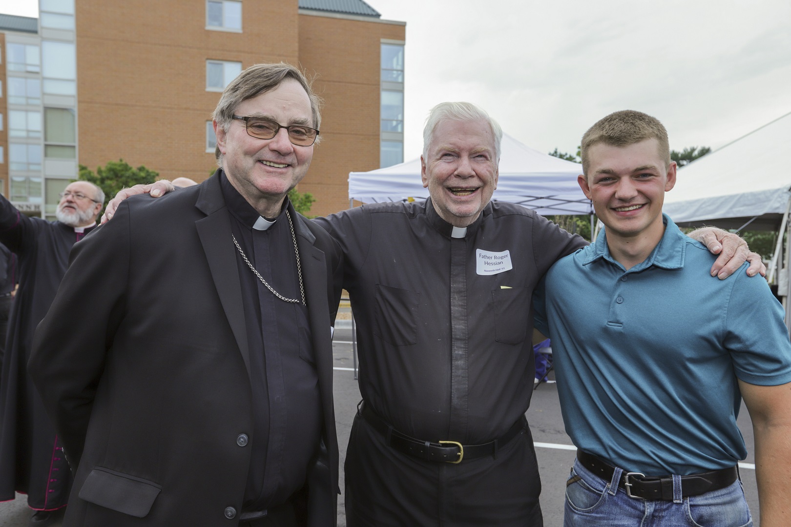 Bishop James Powers, Father Roger Hessian and Elias Budke.