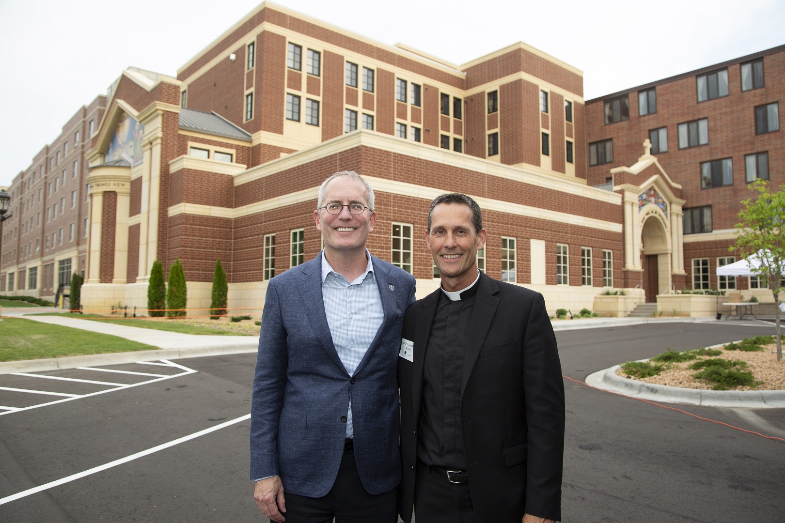 Rob Vischer and Father Jonathan Kelly.