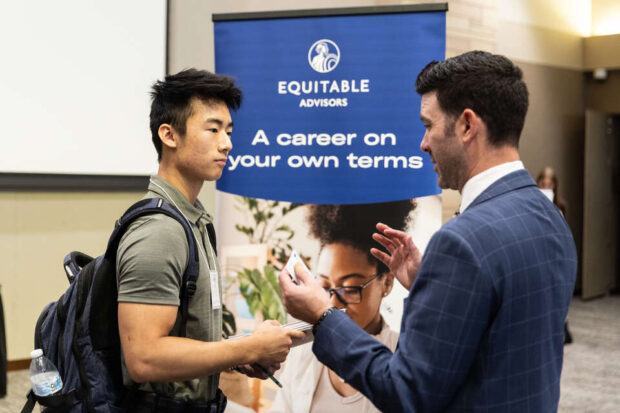 Students meet with prospective employers in Woulfe Alumni Hall in the Anderson Student Center during the St. Thomas Fall Career Day event on September 23, 2022, in St. Paul.