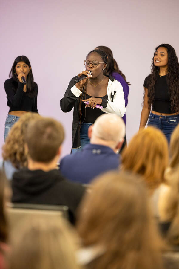 An a cappella group performs.