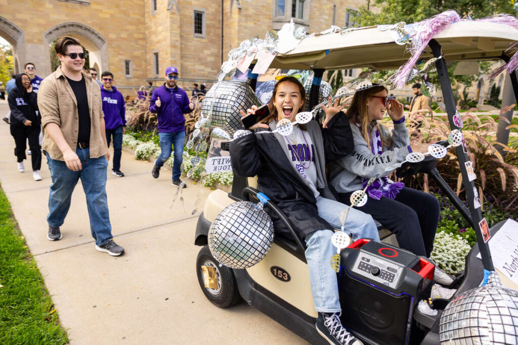 Students on a golf cart.