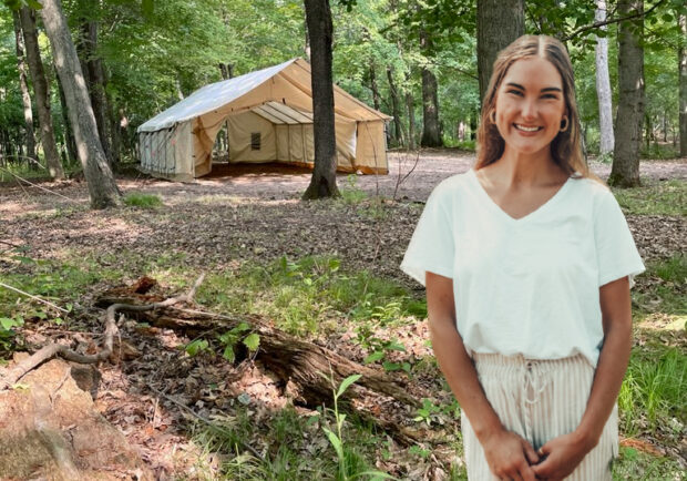 Celia Hansen standing near yurt