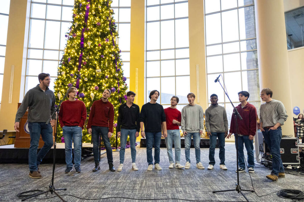 An a cappella group performs.