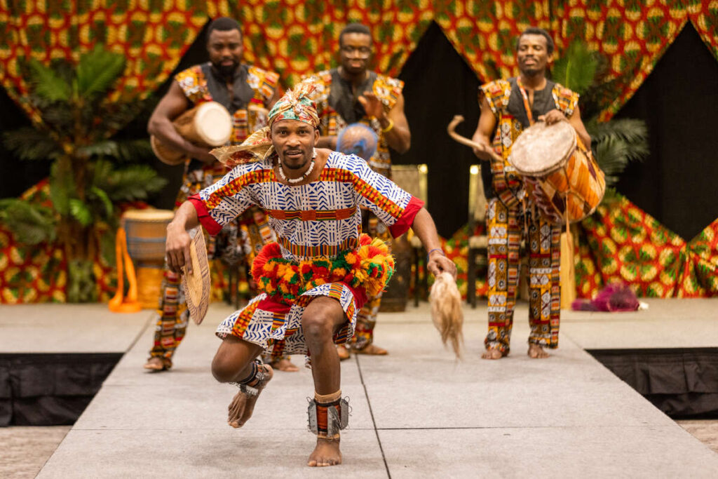 Group performs music and dance at ANSA’s African Night event in Woulfe Alumni Hall on March 12, 2023 in St. Paul.
