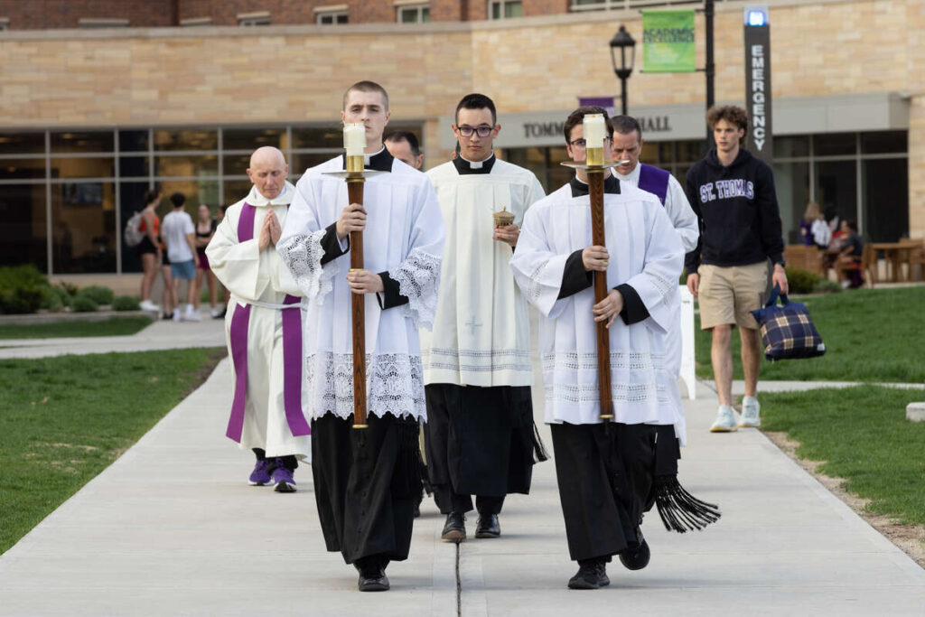 Clergy, seminarians and students attend Shine, an evening of adoration on the upper quad, on May 10, 2023, in St. Paul.
