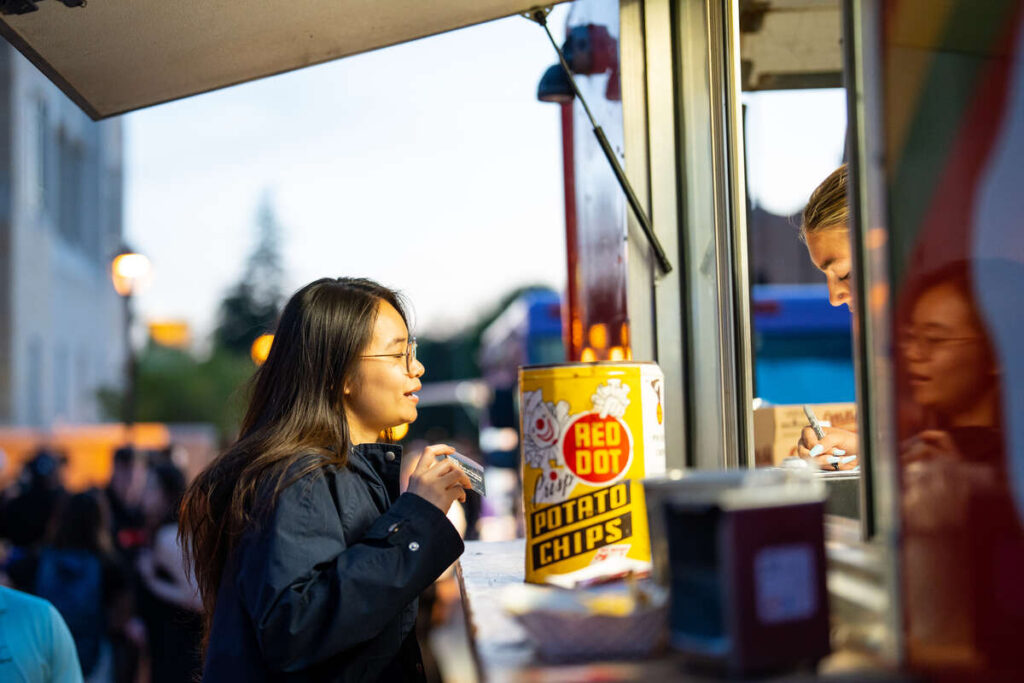 Students gather to visit food trucks on Monahan Plaza for a late night breakfast on study Monday on May 15, 2023, in St. Paul.
