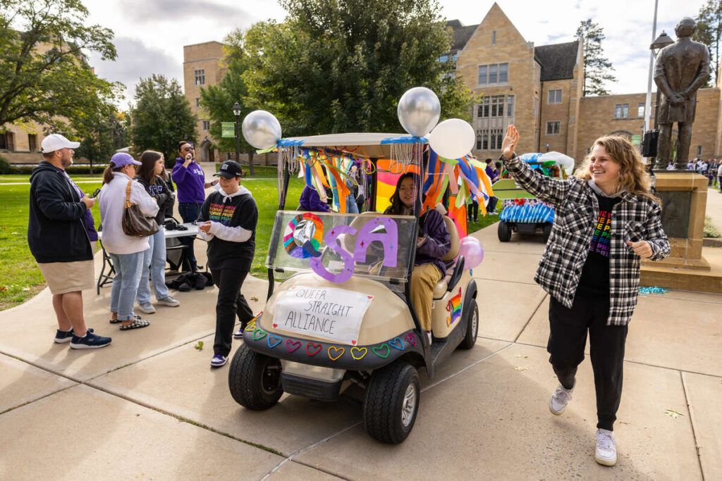 Members of the Queer Straight Alliance during the Homecoming Golf Cart Parade on the St. Paul campus on October 7, 2023.