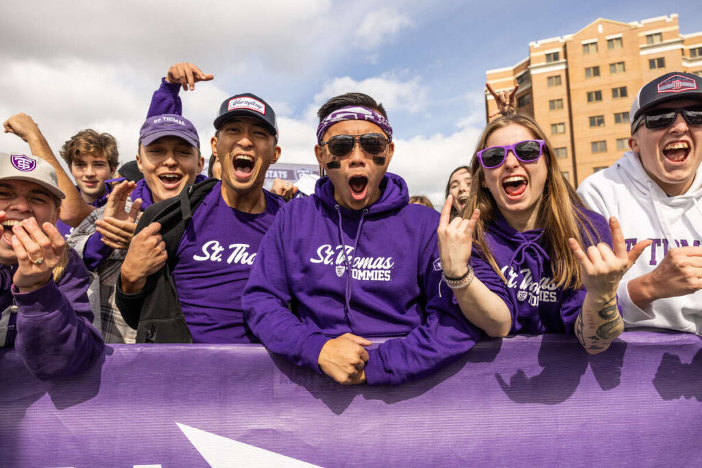 Student fans cheer during the Homecoming Football Game in O’Shaughnessy Stadium on the St. Paul campus on October 7, 2023. The Tommies defeated the Baylor University Bulldogs by a final score of 17 to 10.
