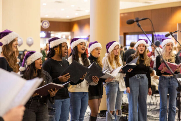 Cadenza performs at the Holiday Tree Lighting Ceremony in the Anderson Student Center on November 29, 2023, in St. Paul.