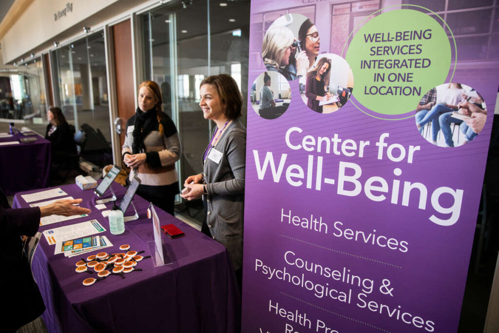 Melanie Tucker, Director of Health Promotion, Resilience, and Violence Prevention, center, and Lisa Voland, Health Case Manager, from the Center for Well-Being staff a table on the second floor of the Anderson Student Center to help answer anyone’s questions or concerns regarding Coronavirus and COVID-19 on March 13, 2020.