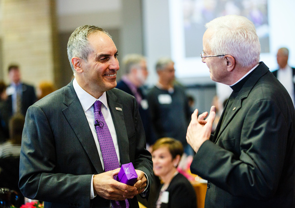 Andy Cecere '82 talks with Father Dease