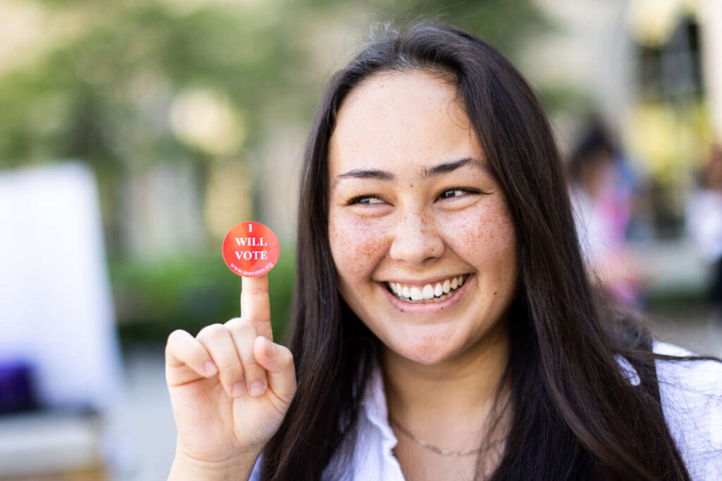 Student with a voting sticker.
