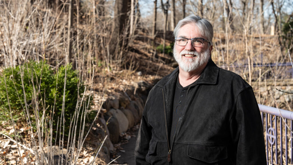 Environmental portrait of Geology Professor Tom Hickson, taken in the Grotto on April 12, 2024.