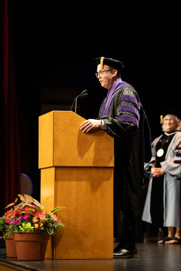 Joel Nichols speaking at School of Law commencement.