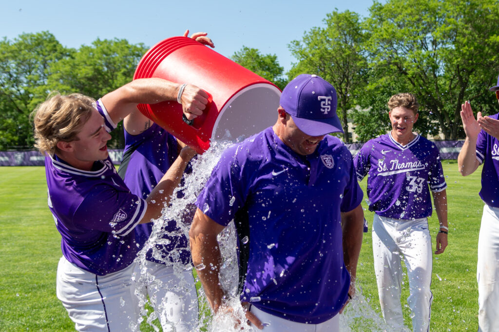 Head coach Chris Olean is doused in ice water after securing the championship.