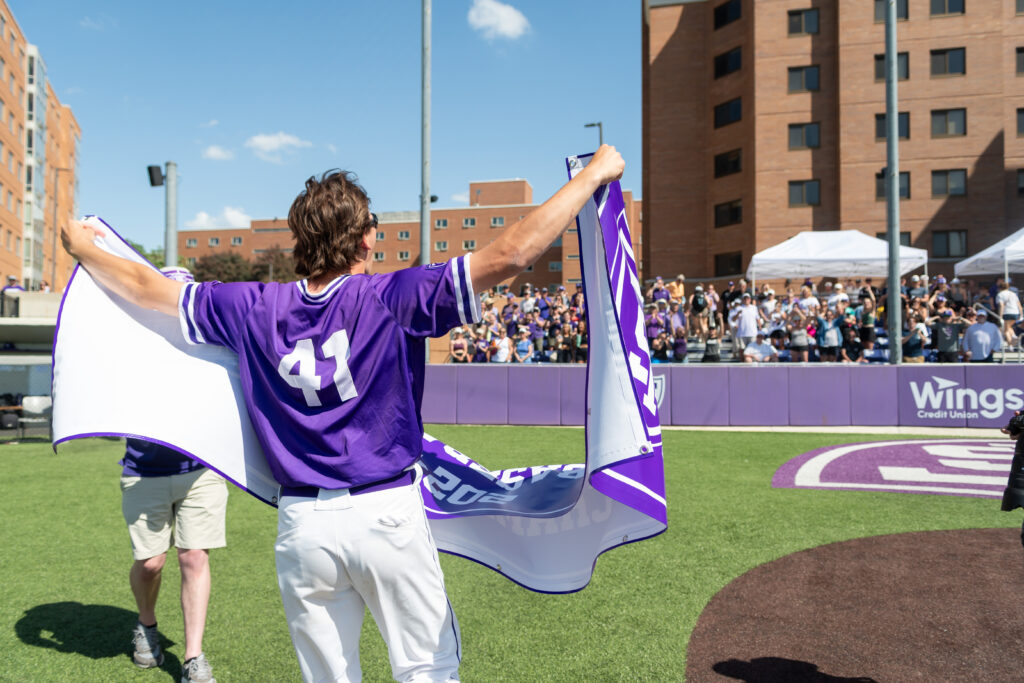 The Tommie Baseball team celebrates after clinching their first Summit League Championship Title.