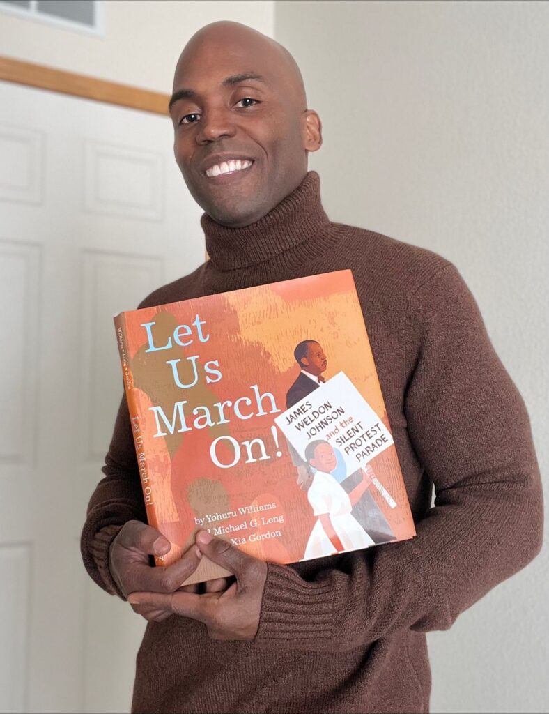 Dr. Yohuru Williams holds his book Let Us March On