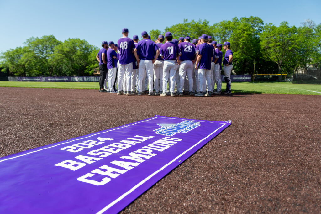 The Tommie Baseball team celebrates after clinching their first Summit League Championship Title.