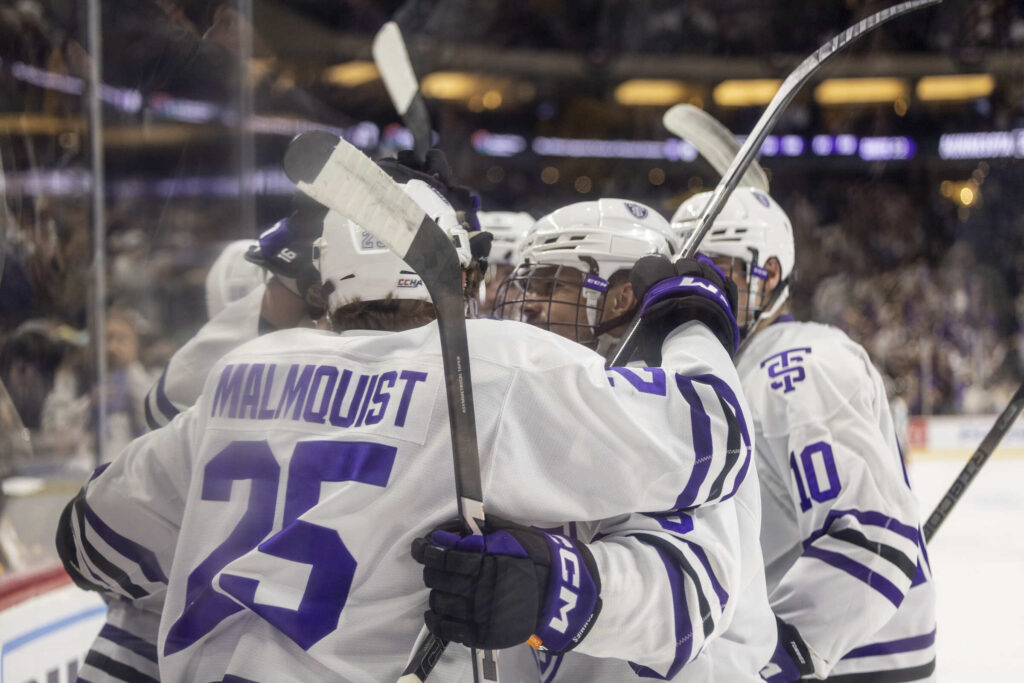 St. Thomas hockey team huddle