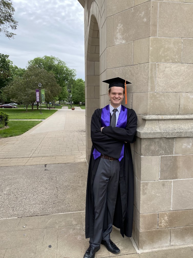 Nathan LoPresto poses in front of the Arches after graduating from the University of St. Thomas School of Engineering.