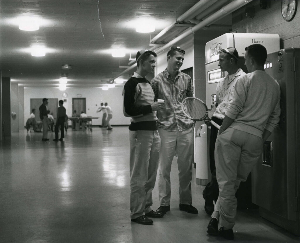 Freshmen talking in Dowling Hall in 1960.