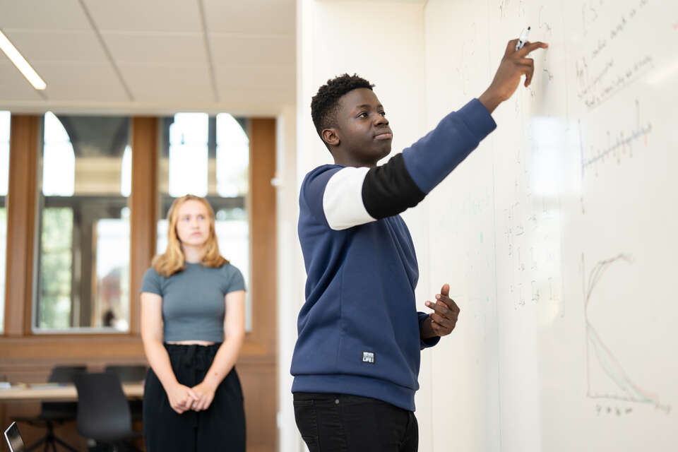 Students in Mathematics Professor Natasa Dragovic summer research class work on a research project focused on political campaigns in Schoenecker Center on August 7, 2024, in St. Paul.