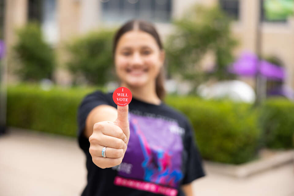 Students pose with Voting Stickers at Pack the Quad on Monahan Plaza on September 6, 2024 in St. Paul.