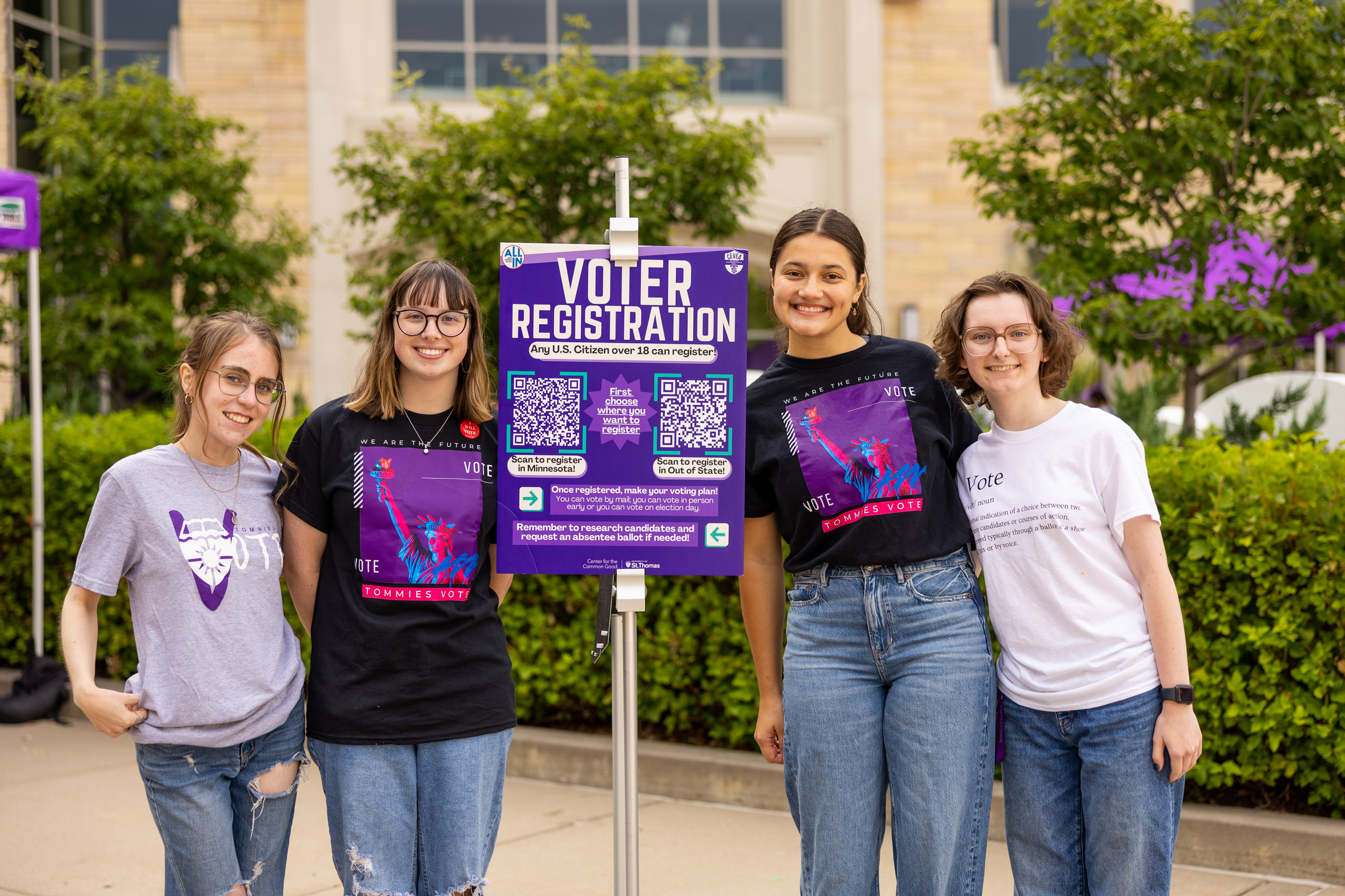 Voter registration booth student workers pose for a photo at Pack the Quad on Monahan Plaza on September 6, 2024 in St. Paul.