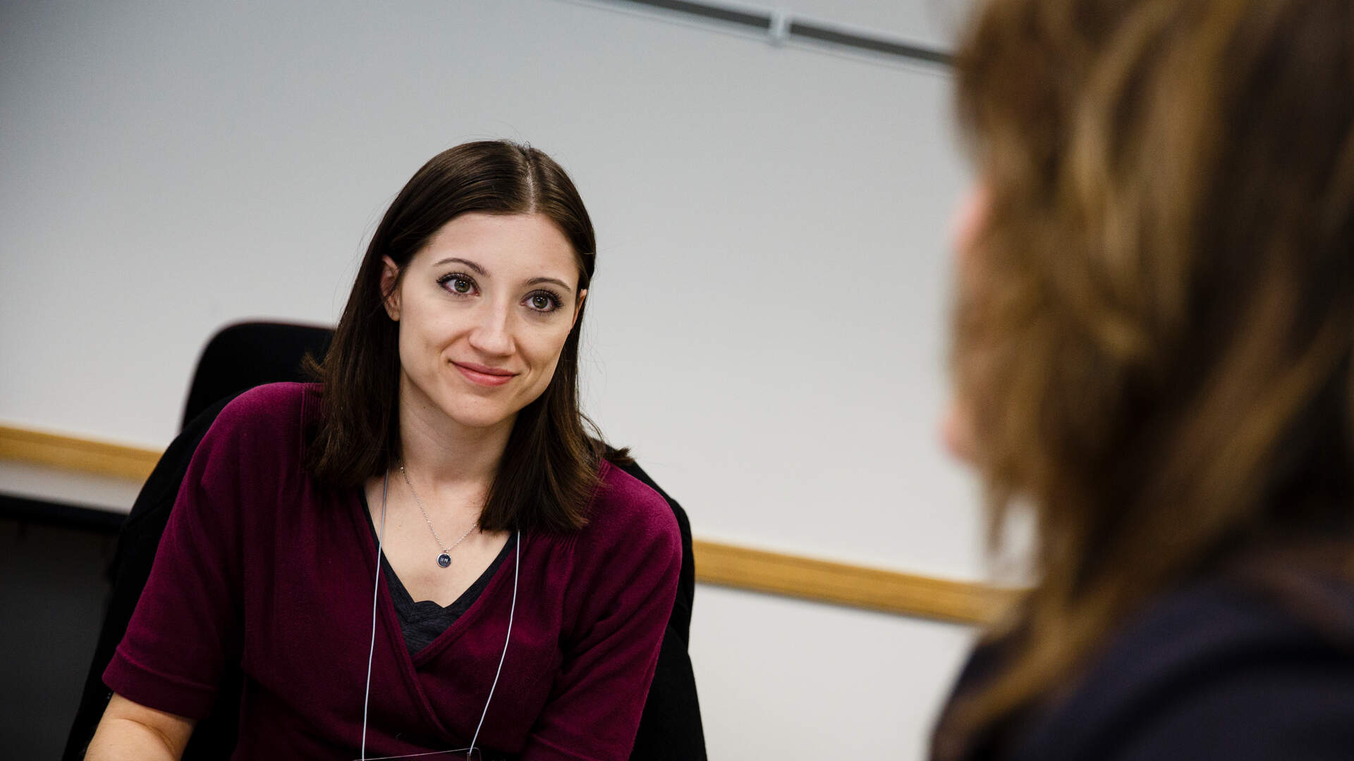 Woman engaged in listening exercise