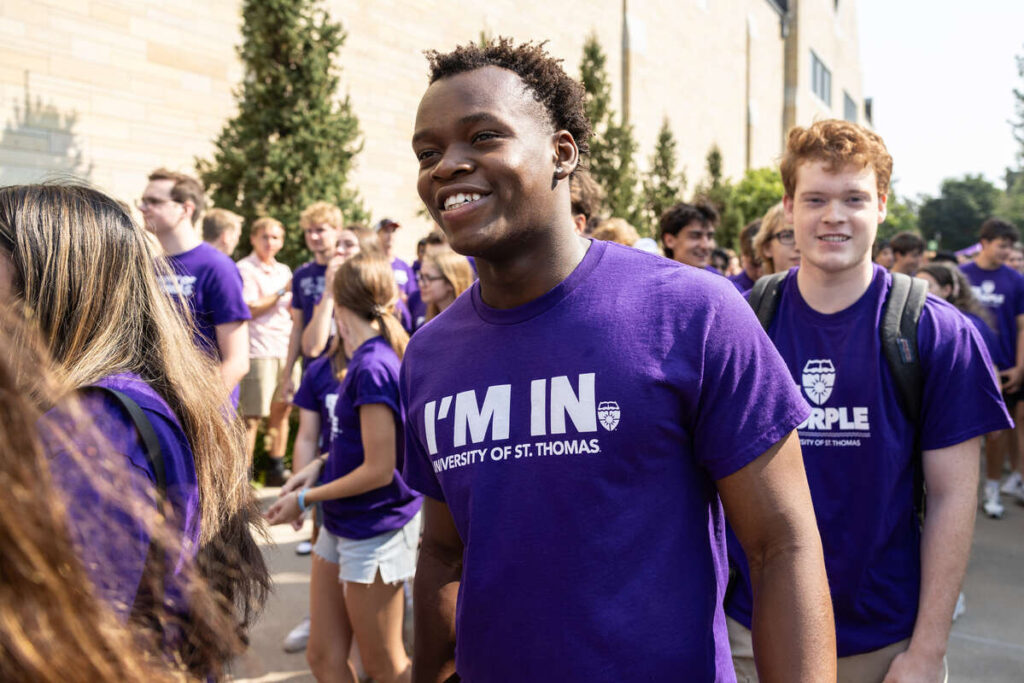 Students march through the Arches.