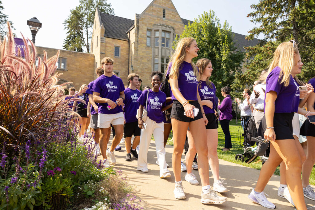 Students, staff, faculty, family and supporters gather for the annual March Through the Arches event on September 3, 2024, in St. Paul.