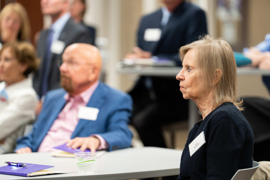 Ann Winblad with Dick Schulze in background