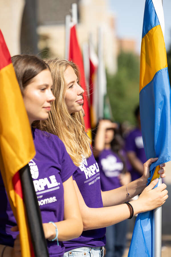 International students holding flags