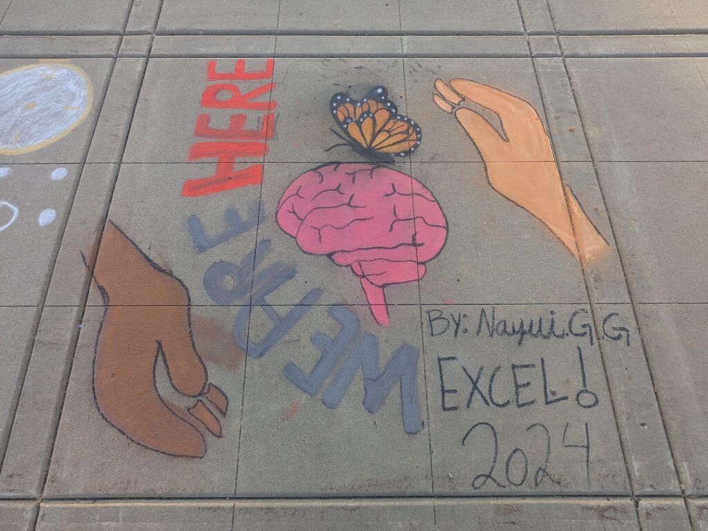 Garcia's completed image of brain with butterfly and the words, "We are here."