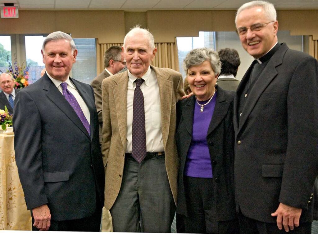 Al McQuinn, Harry McNeely, Mary Agnes McQuinn and President Emeritus Father Dennis Dease.