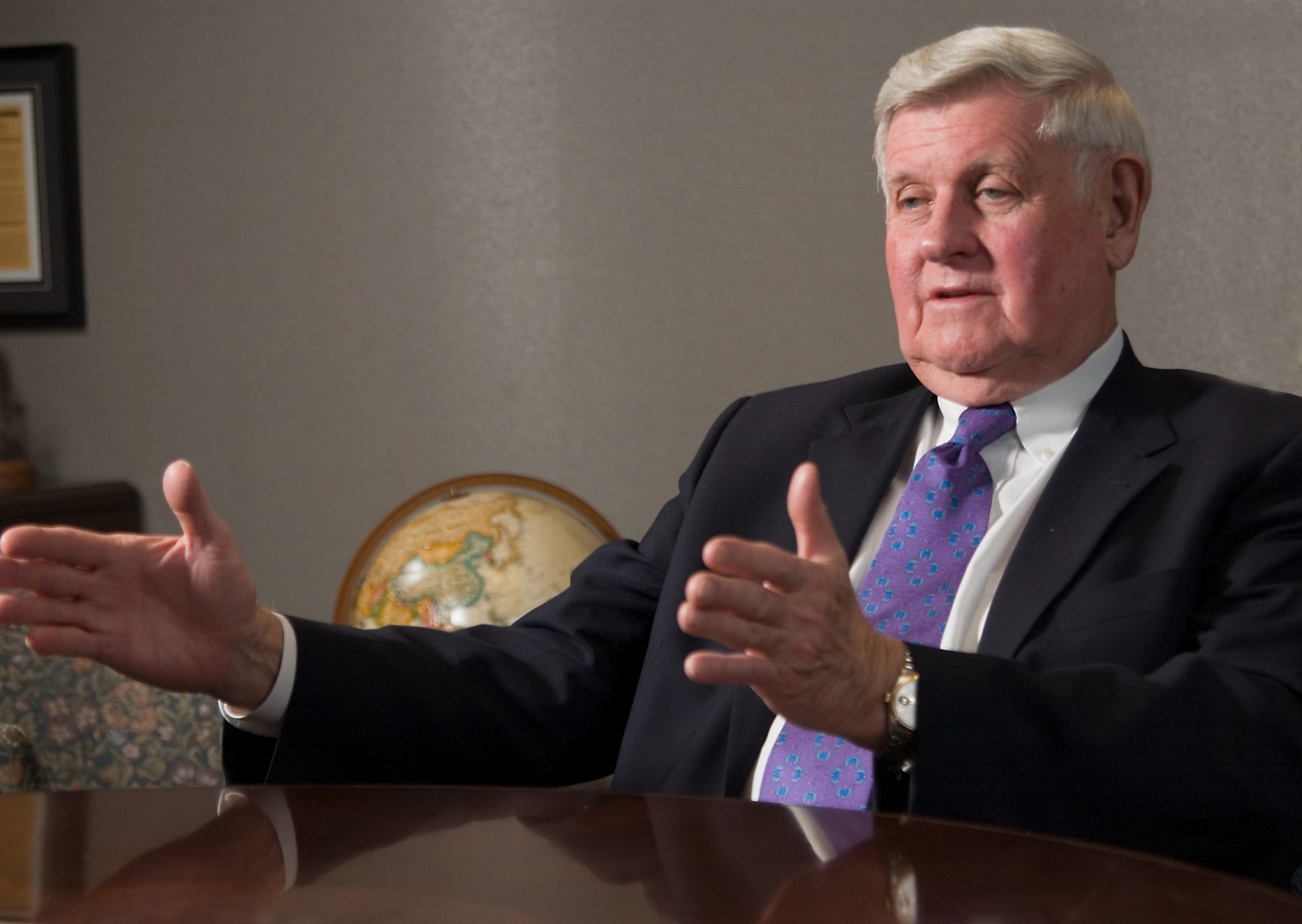 Al McQuinn sitting at a desk.