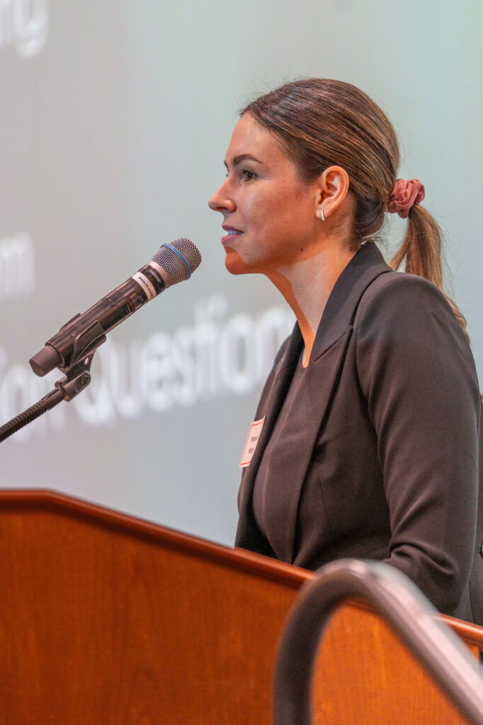 Portrait of Florence Wright speaking at a School of Social Work alumni event.