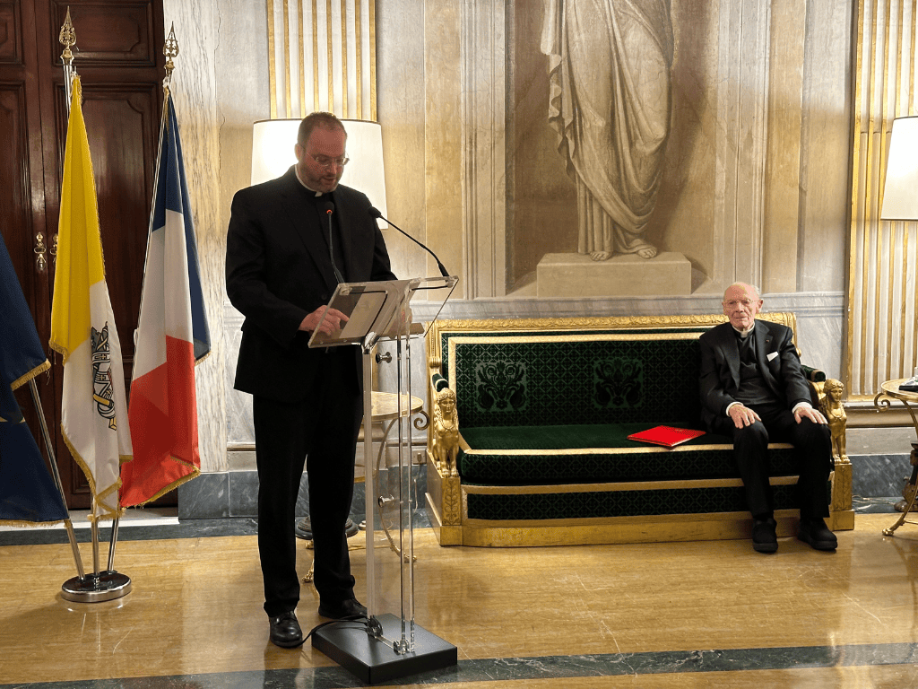 Father Evan Koop speaking