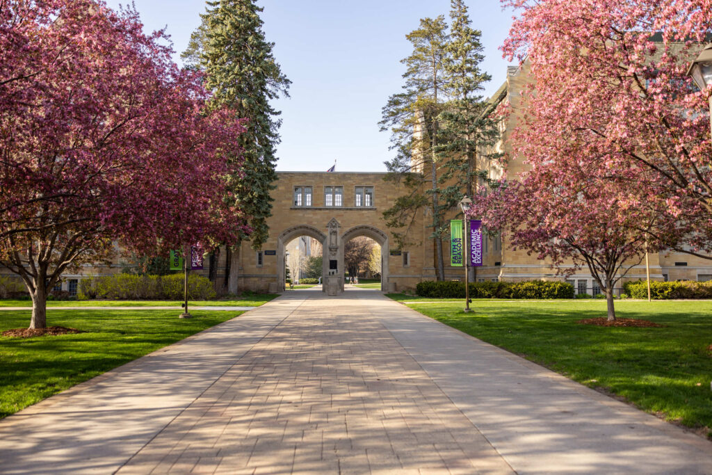 Campus scene of Arches with flowering trees on a sunny Spring day taken on April 25, 2024 in St. Paul.