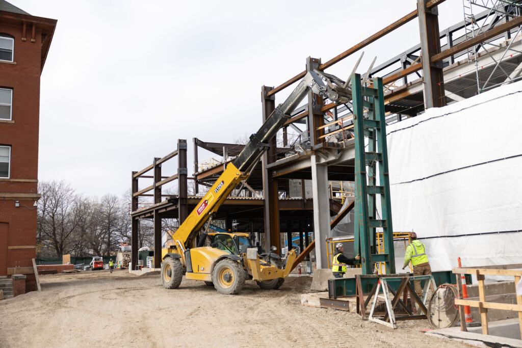 Crews work on the southern end of the Lee & Penny Anderson arena.